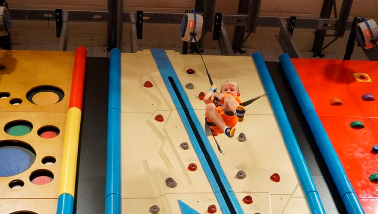 Boy On Climbing Wall